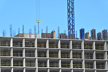 Crane and highrise construction site