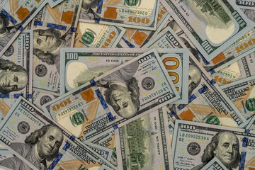 Fototapeta na wymiar Background with banknotes of american 100 dollars bills. Cash money banknotes.