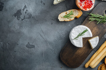 French camembert cheese, on gray background, flat lay  with copy space for text