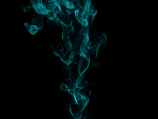 Chaotic mixing smoke creates abstract patterns on a black background