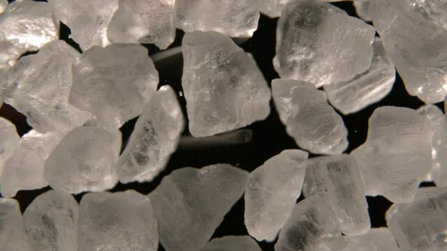 Tweezers Pick Up Meth Or Crystal In Black Environment. Cocaine, Diamond, Meth, or Ice.