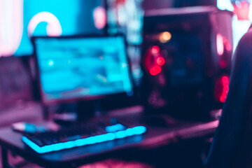 Unfocused and blur background of set up of gamer pc with monitor, keyboard and cpu. © Djavan Rodriguez