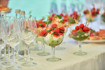 Buffet table with snacks, canape, sandwiches and appetizers at luxury wedding reception outdoors, copy space. Serving food. Catering banquet table