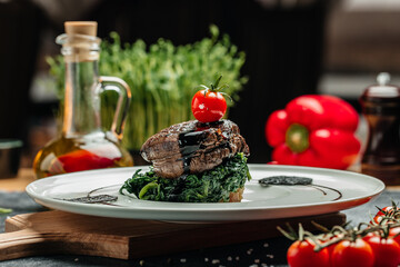 Medallions steaks from the beef tenderloin with spinach, Delicious balanced food concept