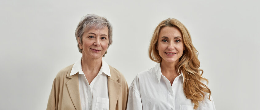Banner portrait of mother and adult daughter