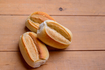 French rolls. Brazilian breads on wooden table.