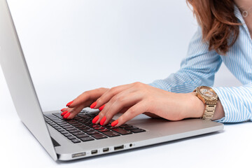 female hands typing on laptop keyboard. isolated