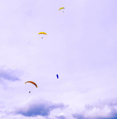 
paragliding in the mountains of curiti santander coombia enjoying a purple sunset