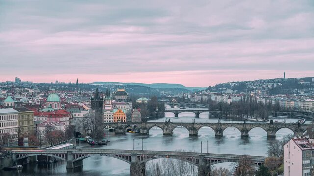 4k time lapse of sunrise in Prague with view on the Moldau river and Charles bridge