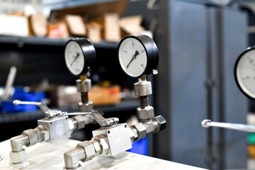Turned off hydraulic oil station in the workshop close-up.