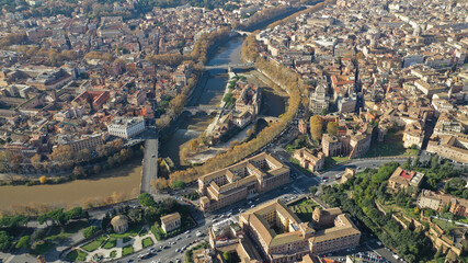 Aerial drone photo of Tiber island or Isola Tiberina, a small island in a bend of the River Tiber with a number of historical buildings and monuments, Rome historic centre, Italy