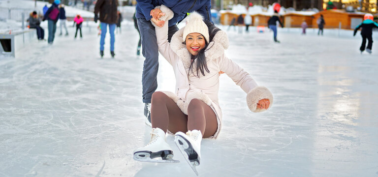 woman ice skating outdoors on winter day