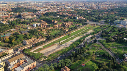 Fototapeta na wymiar Aerial drone photo of iconic Circus Maximus a green space and remains of a stone - marble arena used for chariot races built next to Palatine hill and world famous Colosseum, historic Rome, Italy