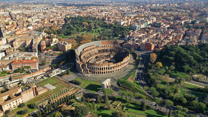 Obraz premium Aerial drone photo of iconic park of Colosseum, a vast archaeological zone encompassing ancient sites like the Colosseum, Circus Maximus and Ancient Forum, Rome historic centre, Italy