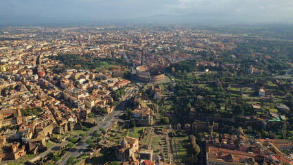 Obraz premium Aerial drone photo of iconic park of Colosseum, a vast archaeological zone encompassing ancient sites like the Colosseum, Circus Maximus and Ancient Forum, Rome historic centre, Italy