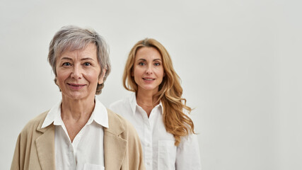 Portrait of older and younger women generations