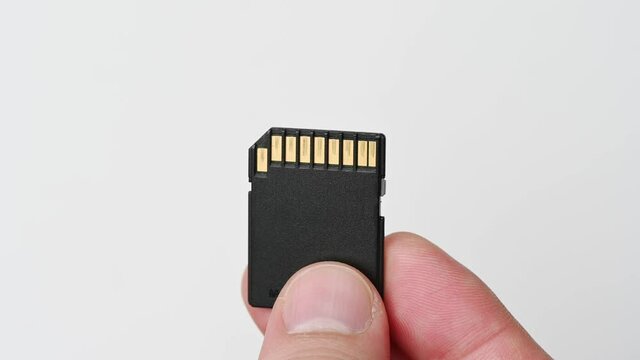 clips video 4k and full HD of memory SD card isolated on clean background this sd card for various computer, digital camera and smart mobile phone devices.
