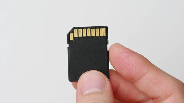 clips video 4k and full HD of memory SD card isolated on clean background this sd card for various computer, digital camera and smart mobile phone devices.