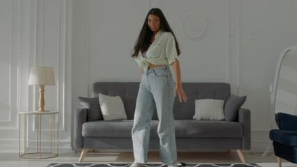 PHONE CAMERA POV, Mixed race teen girl recording trendy dance moves for social media account at home