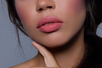 Close-up perfect lip makeup beautiful female mouth. Plump sexy full lips. Macro photo face detail....