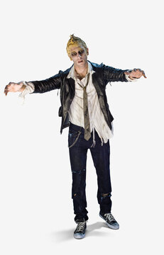 Full length portrait of a zombie looking into camera with a mindless stare and arms outstretched, against a white background