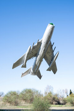 Old fighter jet in the air. Retro image of old aircraft. Vintage airplane close up.