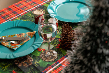 table with water bowl and dishes decorated for Christmas dinner