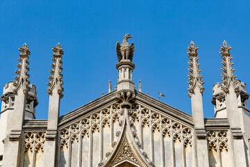 Fototapeta premium St John's College New Court and blank clock tower face, sunny day