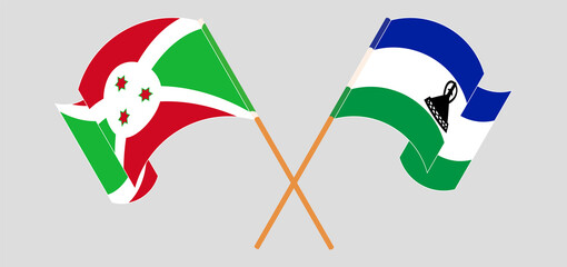 Crossed and waving flags of Burundi and Kingdom of Lesotho