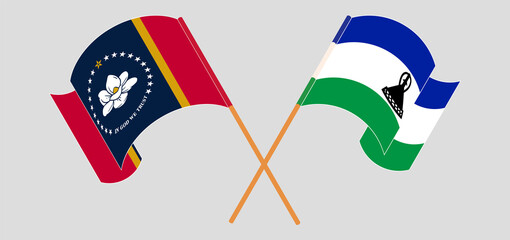 Crossed and waving flags of The State of Mississippi and Kingdom of Lesotho