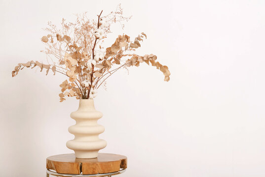 Dry Brown Flowers In Beige Vase