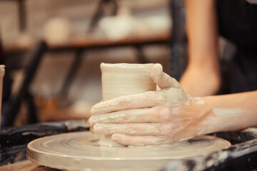 human hands making pottery circle
