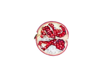 A segment of a ripe pomegranate fruit, isolated on a white background