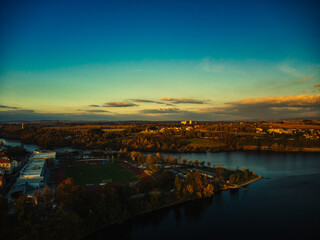 Fototapeta premium aerial view of Tabor czech republic, lake and church tower winter morning sunlight