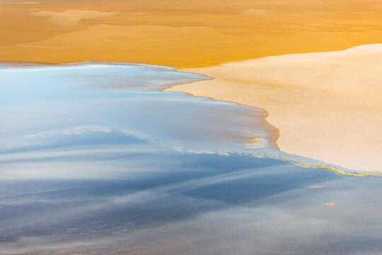 Australian Outback Aerial over Lake Eyre showing blue water and yellow sand