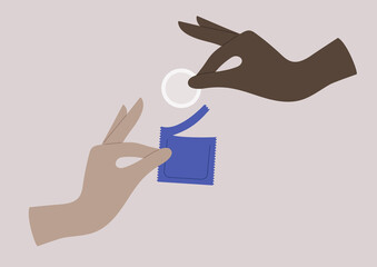 Sexual education, partners hands opening a condom pack
