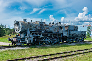 Naklejka premium Ancient steam locomotive at railway station in summer, Haapsalu, Estonia 