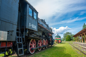 Fototapeta premium Ancient steam locomotive at railway station in summer, Haapsalu, Estonia 