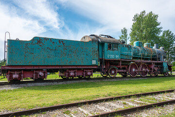 Obraz premium Ancient steam locomotive at railway station in summer, Haapsalu, Estonia 