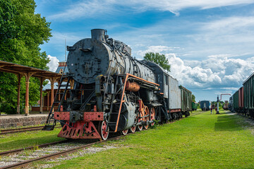 Naklejka premium Ancient steam locomotive at railway station in summer, Haapsalu, Estonia 
