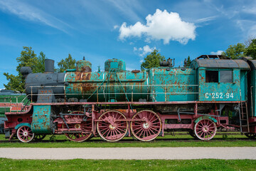 Fototapeta na wymiar Ancient steam locomotive at railway station in summer, Haapsalu, Estonia 