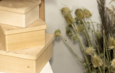 a stack of wooden boxes with iron lock placed one over another. art store, empty box for paint. imagination, inspiration, artist, art shop, pictor. space for text.