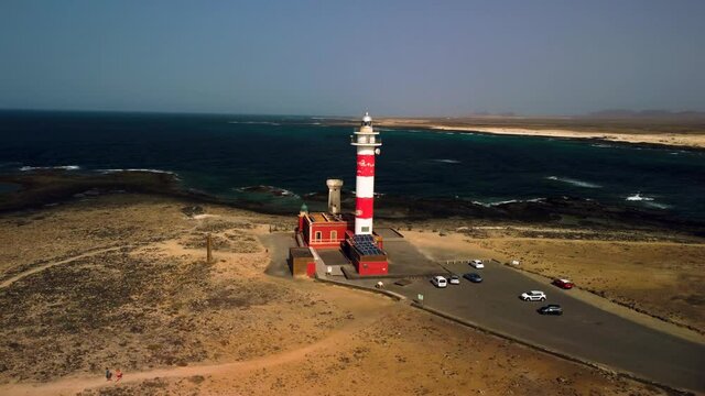 Aerial view of Faro de Toston lighthouse partial orbit El Cotillo Fuerteventura