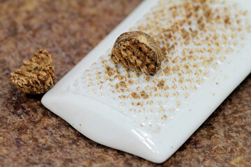 Nutmeg grated on the porcelain grater