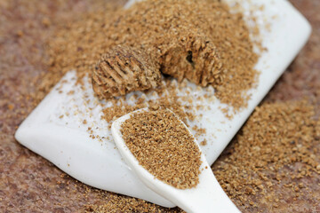 Nutmeg grated on the porcelain grater