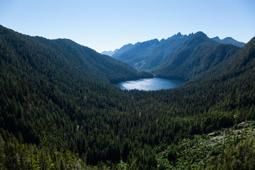 Fototapeta na wymiar Pristine lake, old growth forest in the mountains of Vancouver Island, B.C., Canada, Clayoquot Sound.