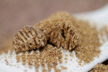 Nutmeg grated on the porcelain grater
