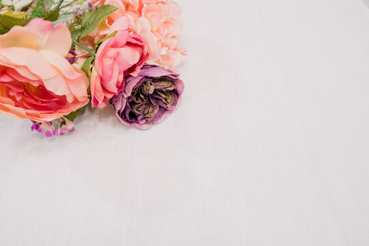 Pink and purple roses on a table