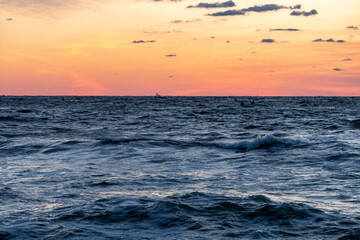 Sunrise at Mansquan inlet with ocean waves and spray