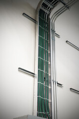 The valves and pipes at a craft modern brewery wall